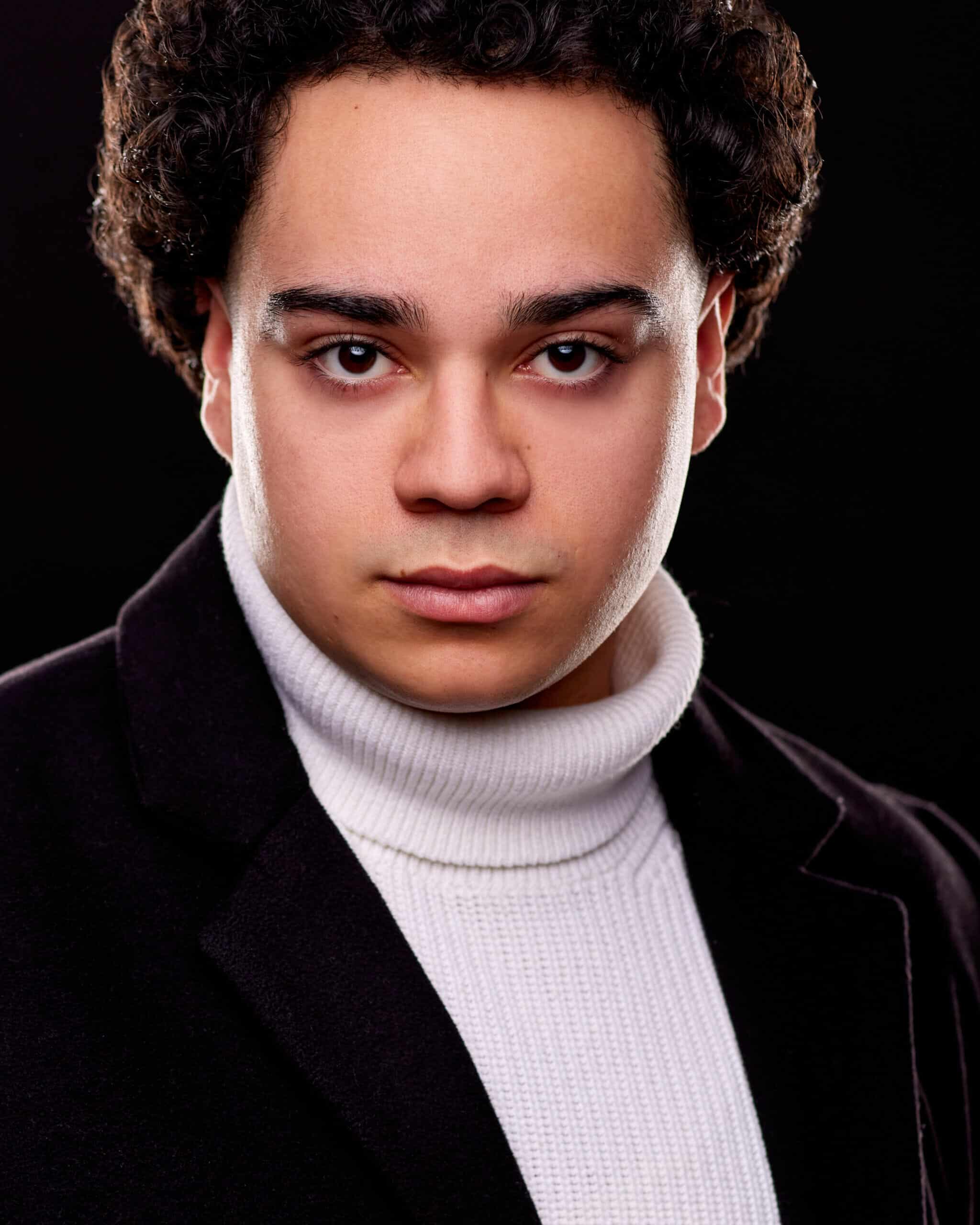Professional headshot with direct expression
